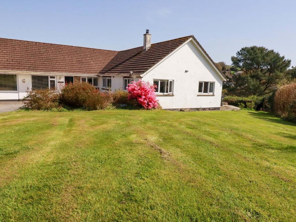 a house with a large yard in front of it at Tregoning in Lostwithiel