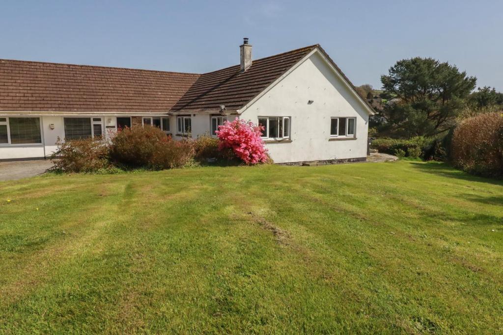 a house with a large yard in front of it at Tregoning Annexe in Lostwithiel