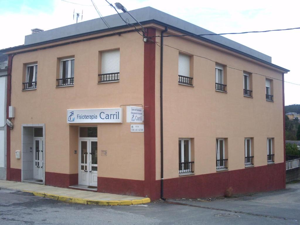 a building with a sign on the side of it at Apartamento Ana Sebastián in Lorenzana