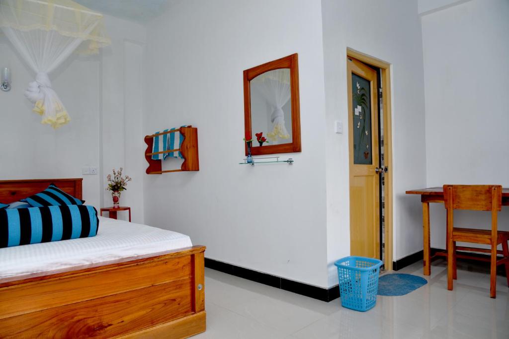 Postel nebo postele na pokoji v ubytování Sunray Homestay