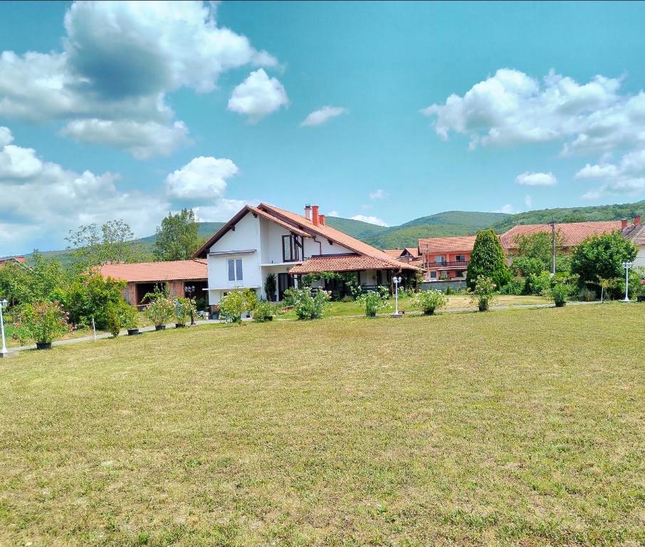 a house with a large field in front of it at Bistrički mir - Imanje in Bistrica