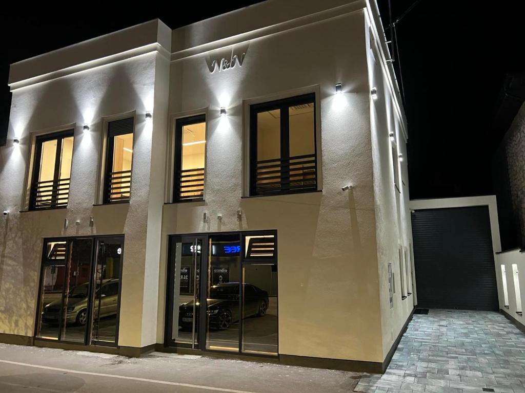 a view of a building at night at Hostel N&N in Kula