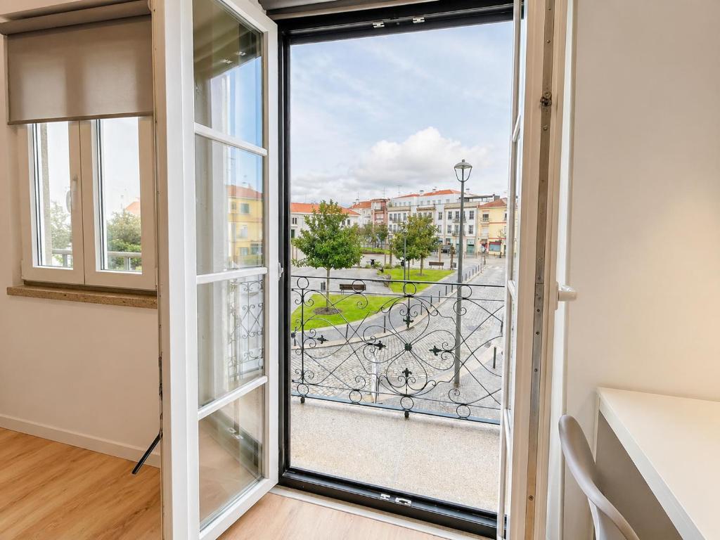 a room with a window with a view of a street at Casa da Villa in Monção