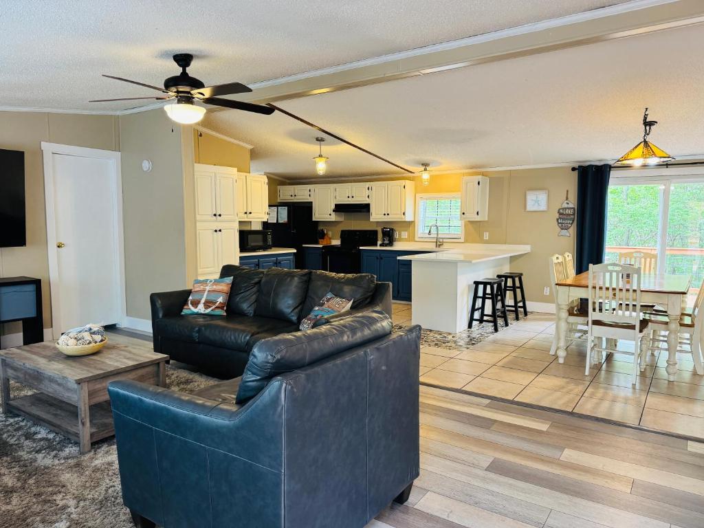a living room and kitchen with a couch and a table at Put-in-Bay Island Club #74 in Put-in-Bay