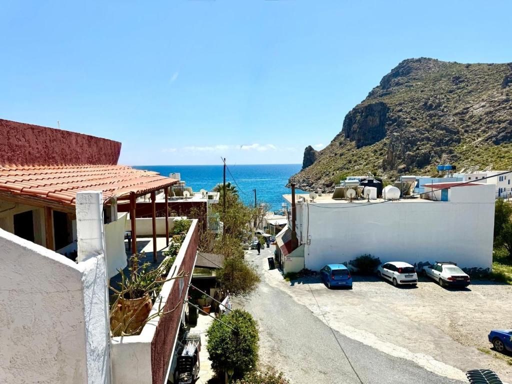 an aerial view of a town with the ocean at Xristinas Rooms in Lentas