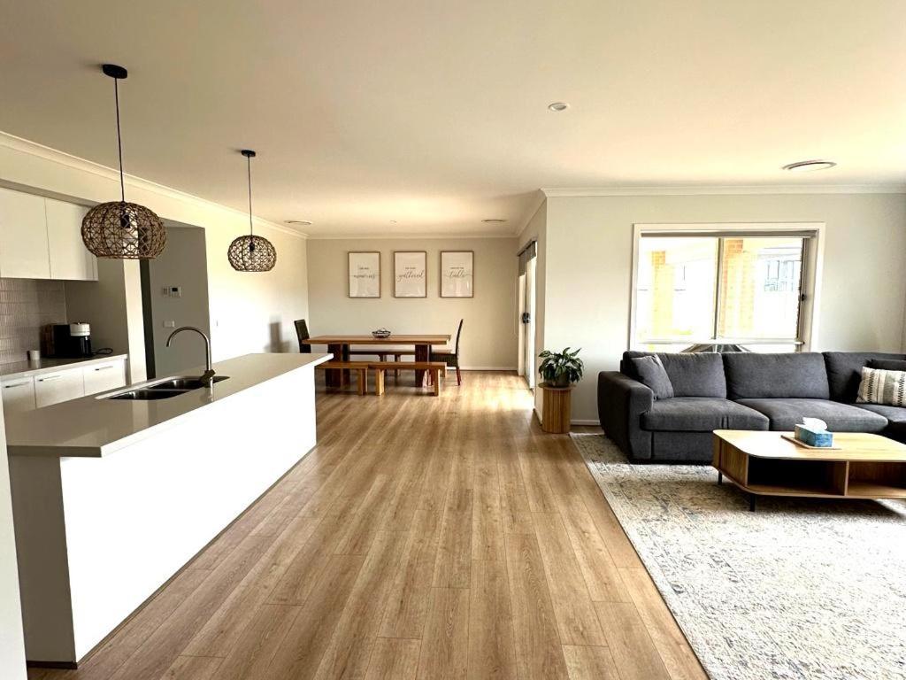 a living room with a couch and a table at Nagambie Lakes in Nagambie
