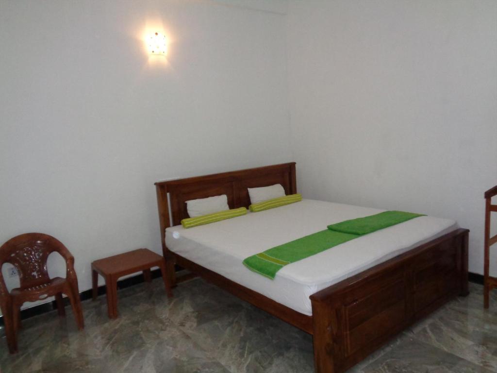 Postel nebo postele na pokoji v ubytování Jayaru Guest House