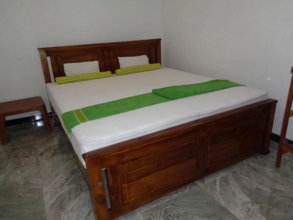 Postel nebo postele na pokoji v ubytování Jayaru Guest House