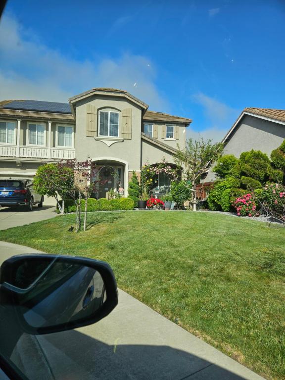 a view from a car mirror of a house at Gateway to Napa in Fairfield