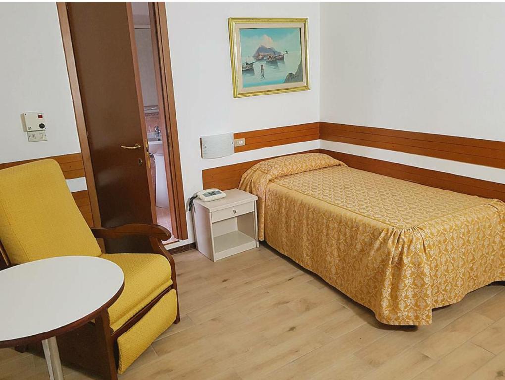 Postel nebo postele na pokoji v ubytování Piccolo Hotel