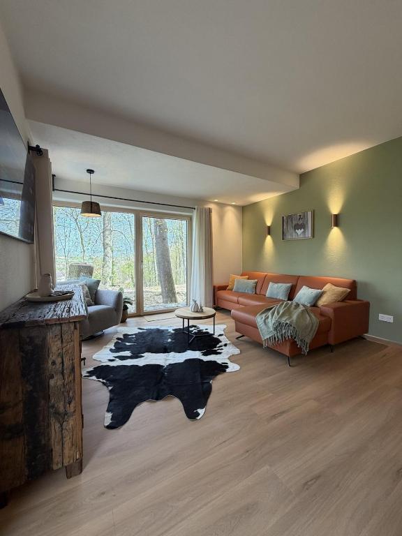 a living room with a couch and a rug at WaldQuartier in Memmelsdorf