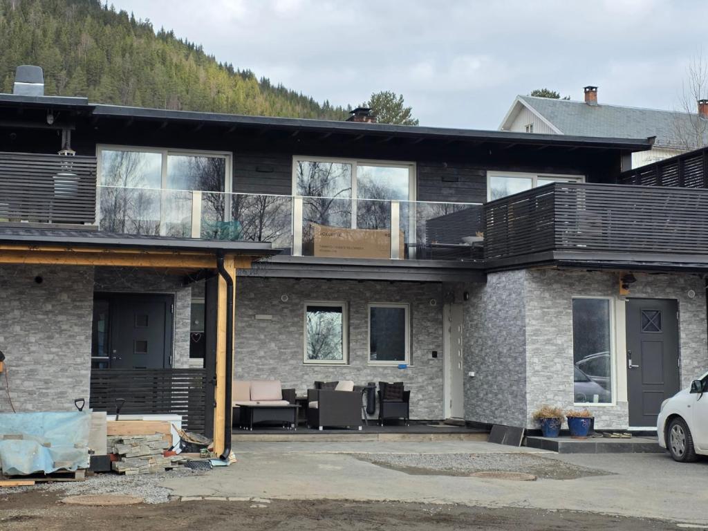 a house under construction with a car parked in front at Hos Jurate in Fagernes