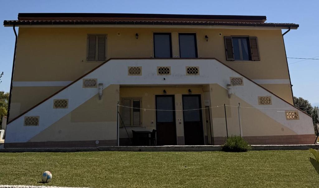 a large house with its door open in a yard at Casa Anna in Santa Maria