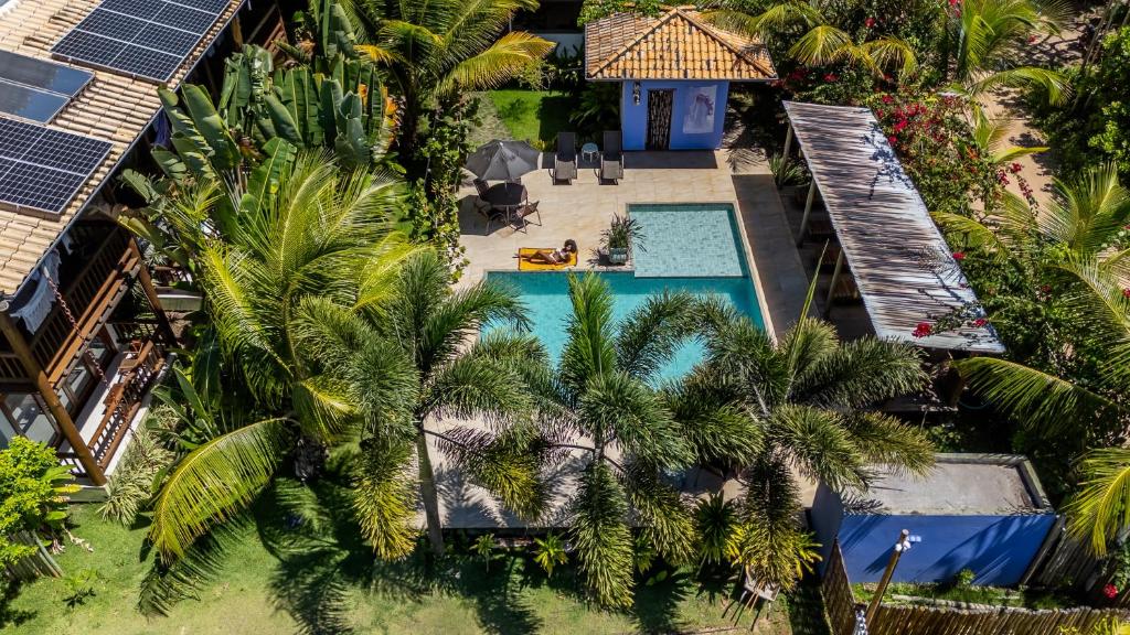 an aerial view of a resort with a pool and palm trees at Taipu Bay Pousada - Taipu de Fora in Barra Grande