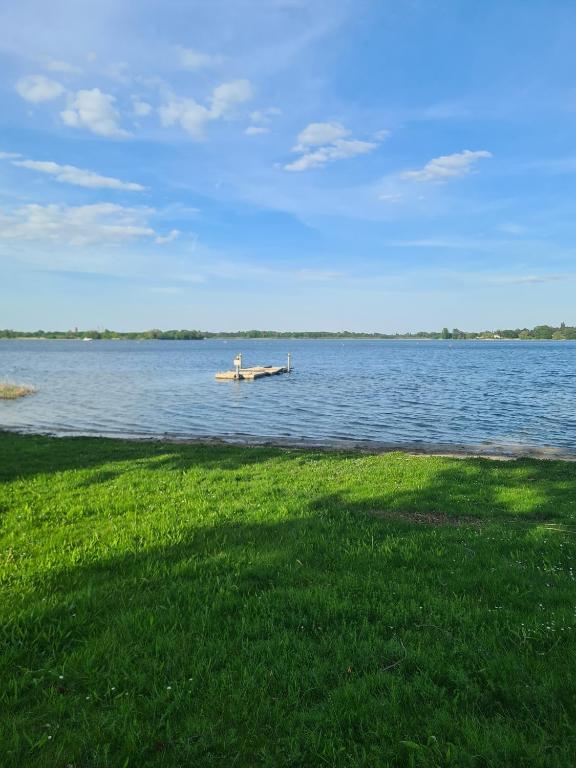 a boat in the middle of a large body of water at Feriendomizil Sasse in Wusterwitz