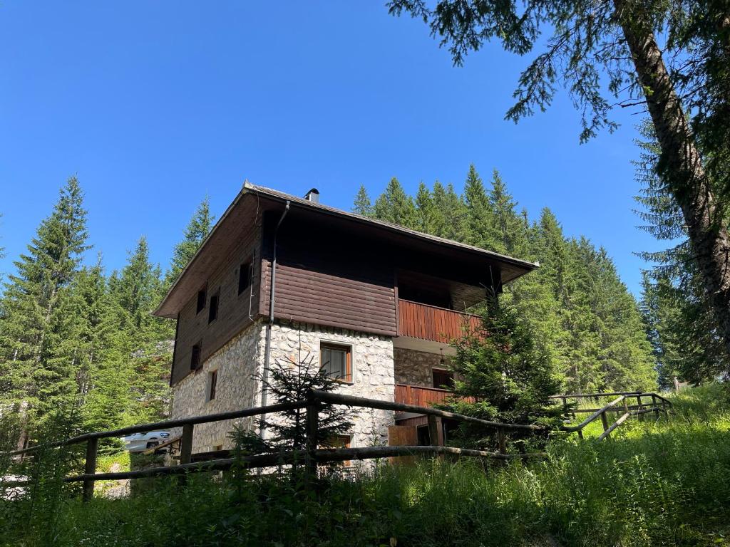 an old building in the middle of a forest at Triglav NP Apartment - above Bled in Zgornje Gorje