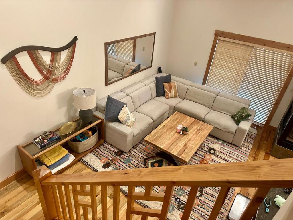 an overhead view of a living room with a couch and a table at Cozy Light Filled Truckee Downtown in Truckee