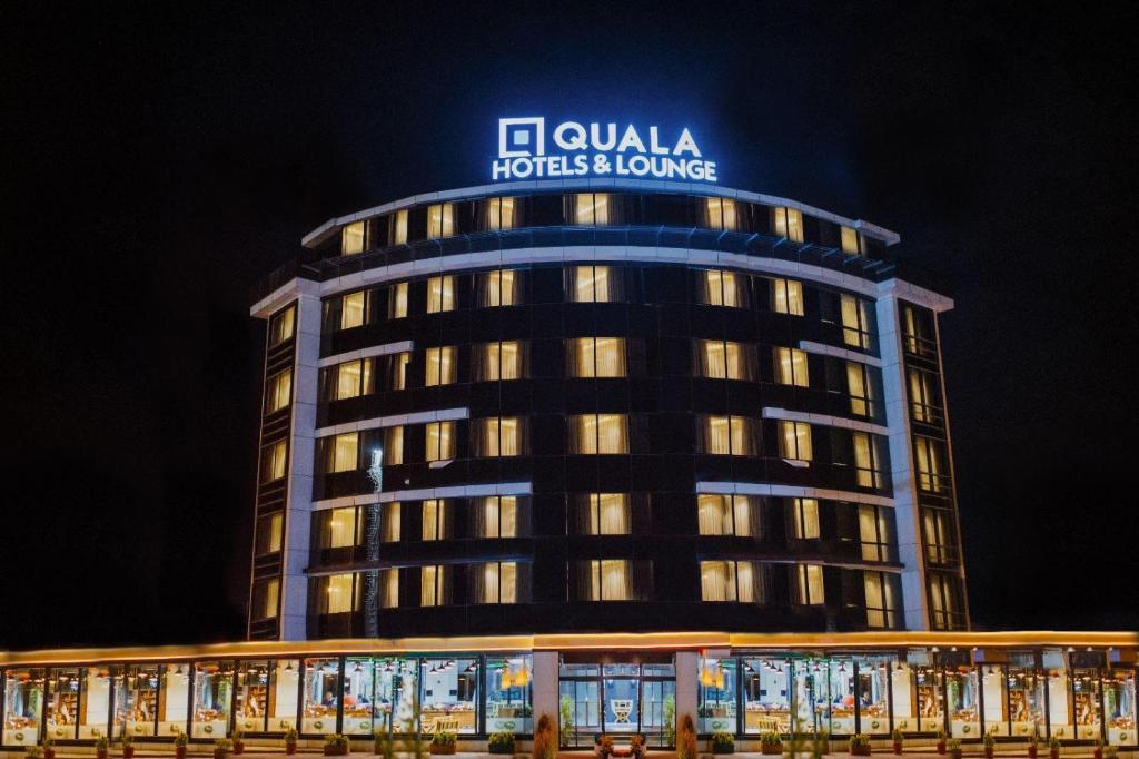 a building with a sign on the top of it at QUALA Hotels in Aksaray