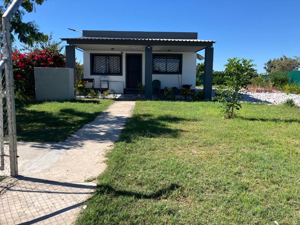 a house with a pathway leading to it at F2 Farmhouse in Omuthiya