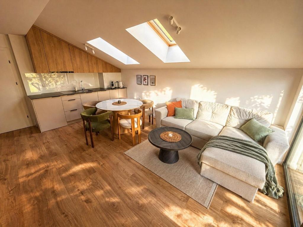 a living room with a couch and a table at Vistula Apartment in Ustroń