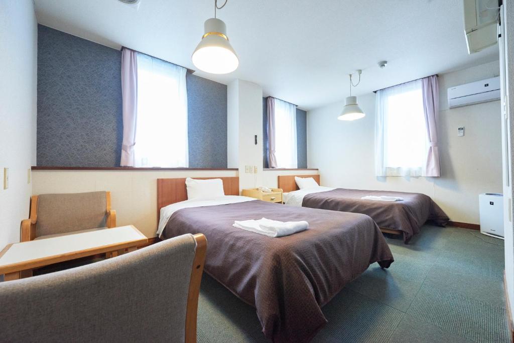 Postel nebo postele na pokoji v ubytování Hotel Select Inn Nishinasuno