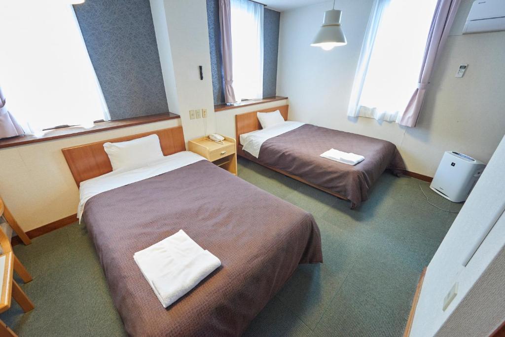 Postel nebo postele na pokoji v ubytování Hotel Select Inn Nishinasuno
