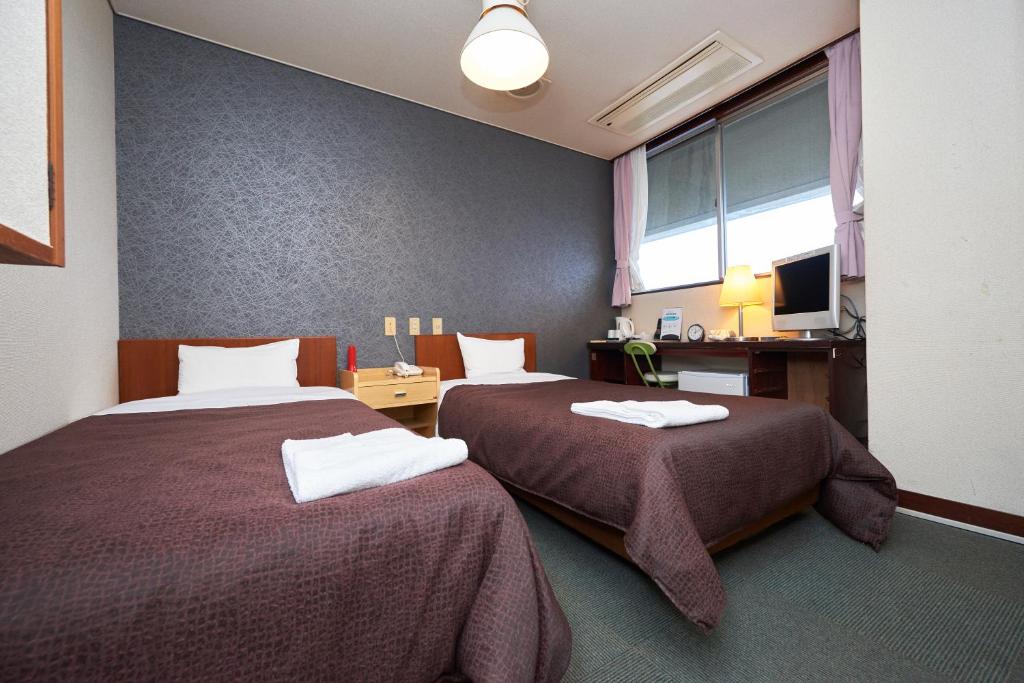 Postel nebo postele na pokoji v ubytování Hotel Select Inn Nishinasuno