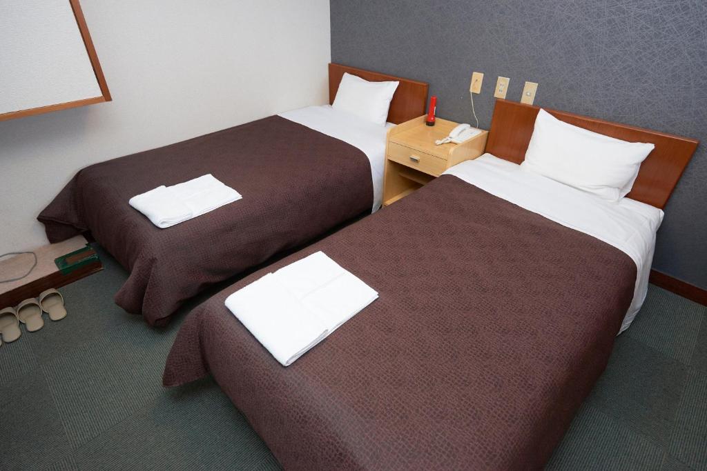 Postel nebo postele na pokoji v ubytování Hotel Select Inn Nishinasuno