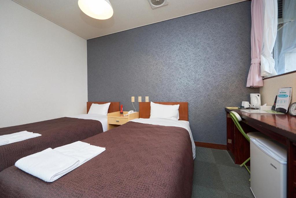 Postel nebo postele na pokoji v ubytování Hotel Select Inn Nishinasuno