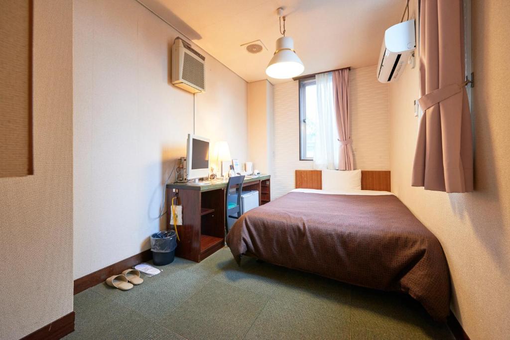 Postel nebo postele na pokoji v ubytování Hotel Select Inn Nishinasuno