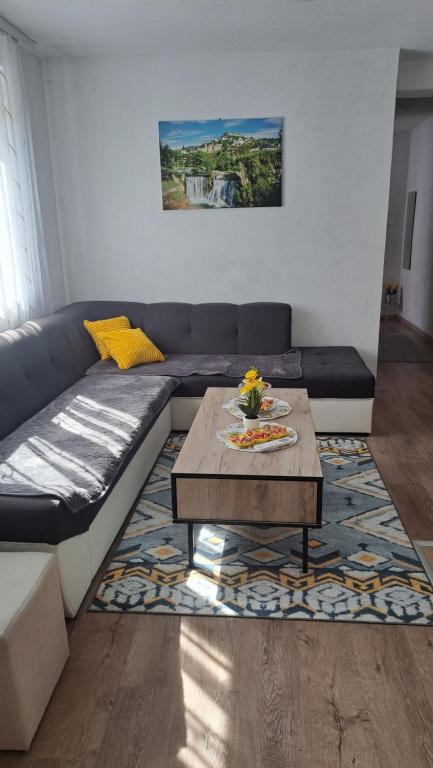 a living room with a couch and a coffee table at Jelena in Jajce