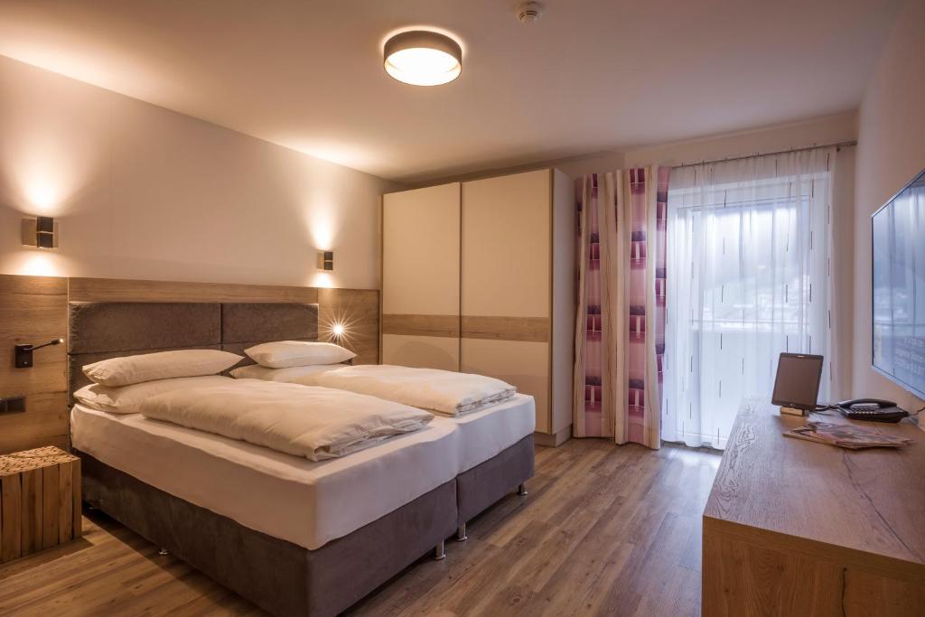 Postel nebo postele na pokoji v ubytování Aparthotel AlpTirol