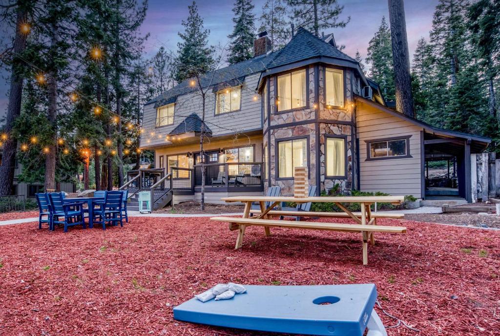 a house with a bench in front of it at Luxurious 7BR Walk 2 Beach and Bus Stop in Carnelian Bay