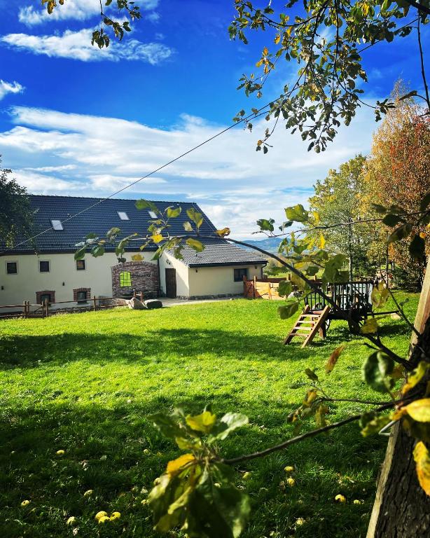 a house with a yard with green grass at Dobków 42 in Dobków