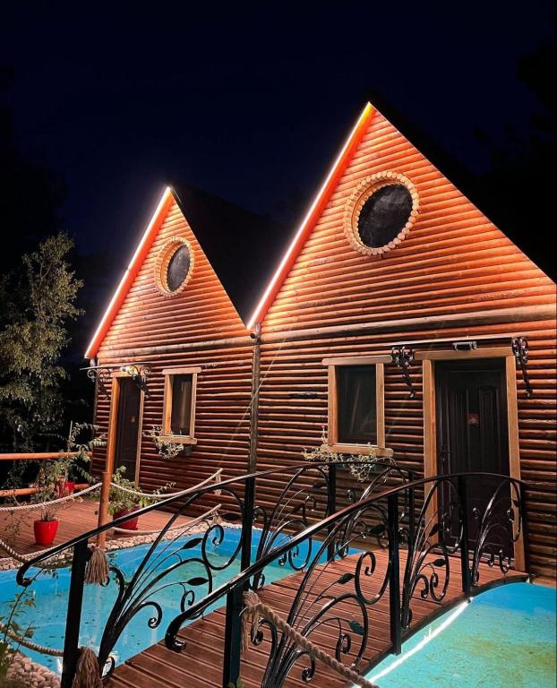 a church with a pool in front of it at night at Dajti Alpin Villas in Tirana