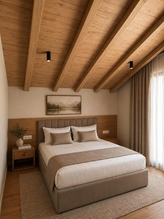 a bedroom with a large bed and a wooden ceiling at Airport Gate Hotel in Rinas