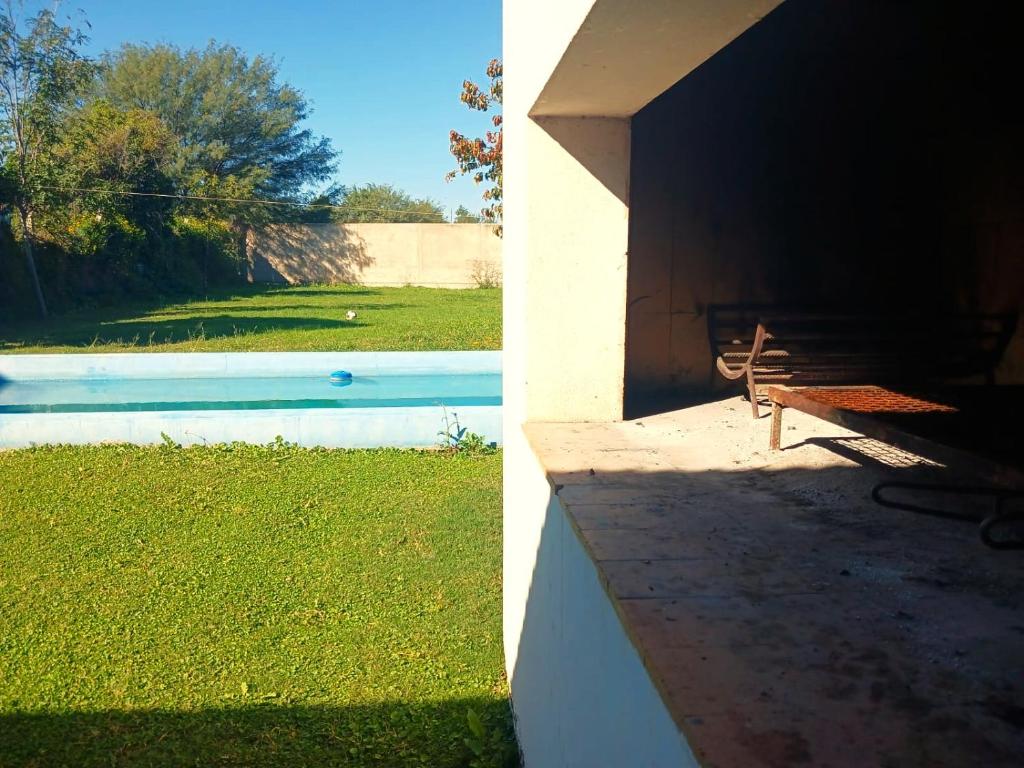 a view of a yard with a bench and a pool at El Recodo in La Rioja