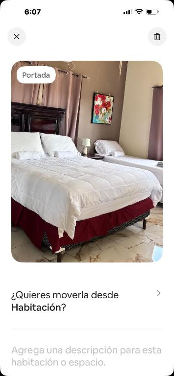 a bedroom with two beds at Ondinas Weekend Spot in La Ceiba