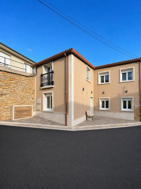 an empty street in front of a building at Casa da Xastra in Vimianzo