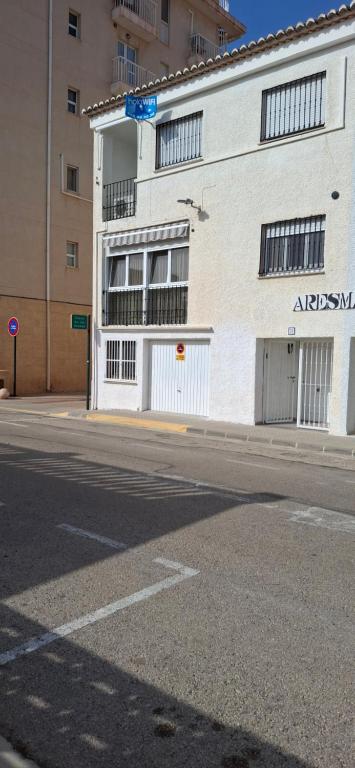 an apartment building on the side of a street at Casa del Sol Miramar in Miramar