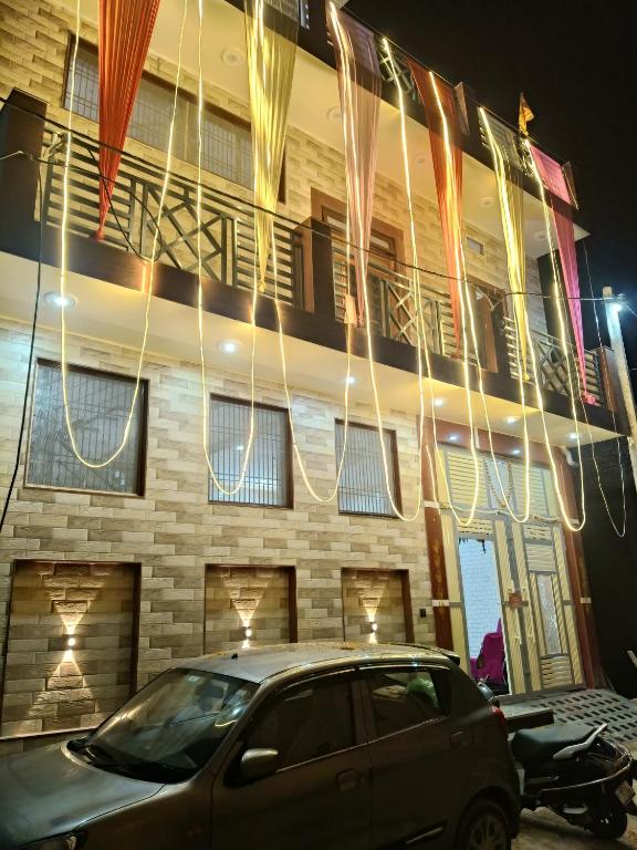 a car parked in front of a building at night at Vallabh Kunj Sewa Sadan in Govardhan