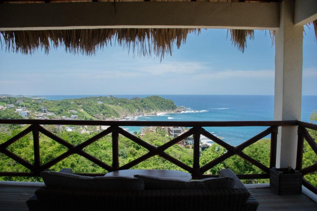 a view of the ocean from the porch of a house at Casa Sacre in Cuatunalco