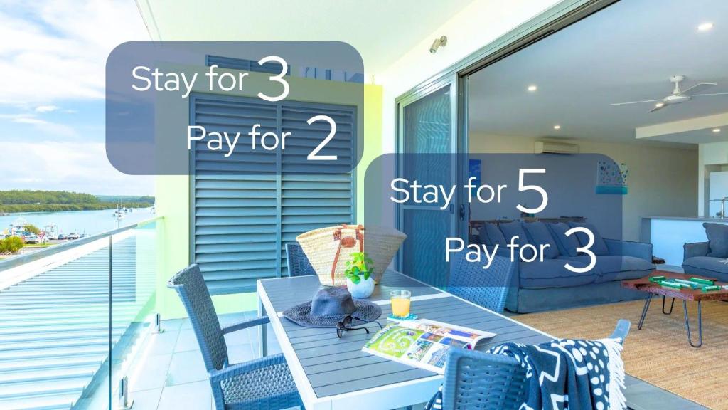 a room with a balcony with a table and chairs at Ishtar Apartment 5 by Book Jervis Bay - Water Views in Huskisson