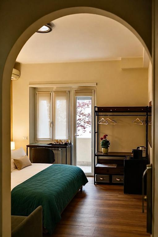 a bedroom with a large bed and a window at Vatican Dolce Remy Guest House - Metro Cipro in Rome