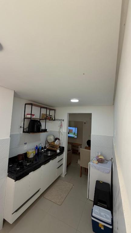 a kitchen with a sink and a counter top at Apt 102 in Parnamirim