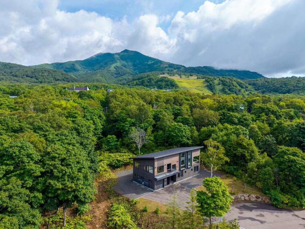 an aerial view of a house in the middle of a forest at Song Saa Chalet in Niseko
