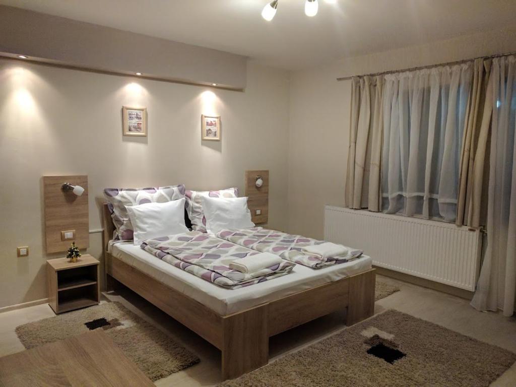 Posteľ alebo postele v izbe v ubytovaní Guest House Dimitrije