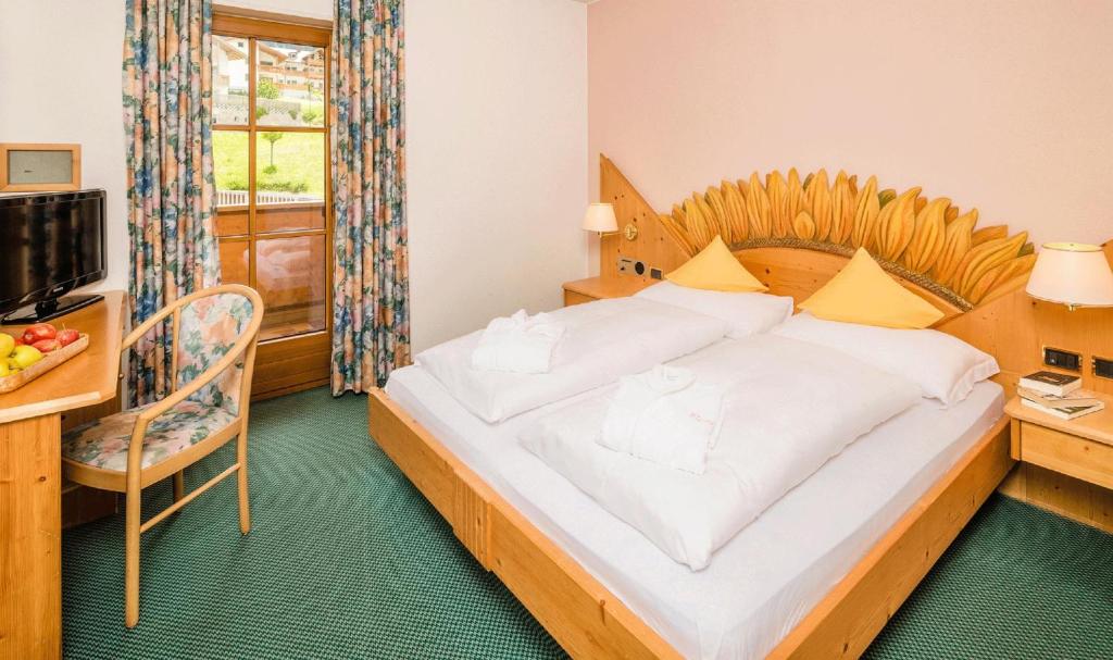 Postel nebo postele na pokoji v ubytování Hotel Rosental