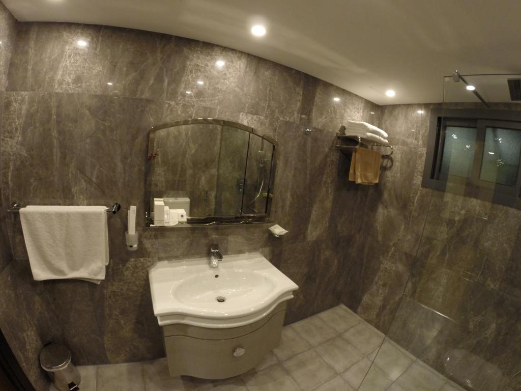 Koupelna v ubytování Le Park Hotel