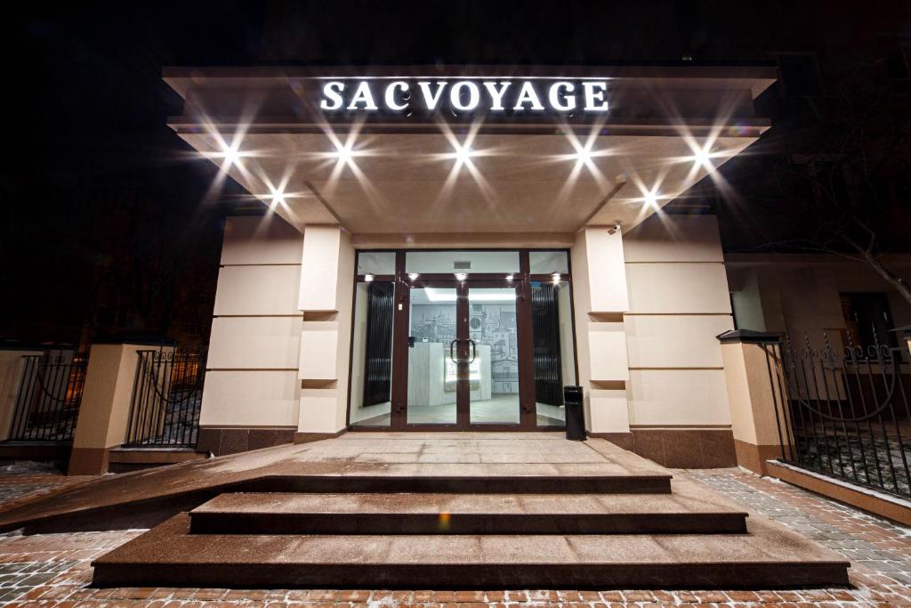 a building with a sign that reads savasurance at Hotel Sacvoyage in Lviv
